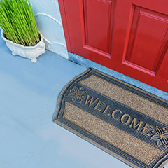 A welcome mat at a front door