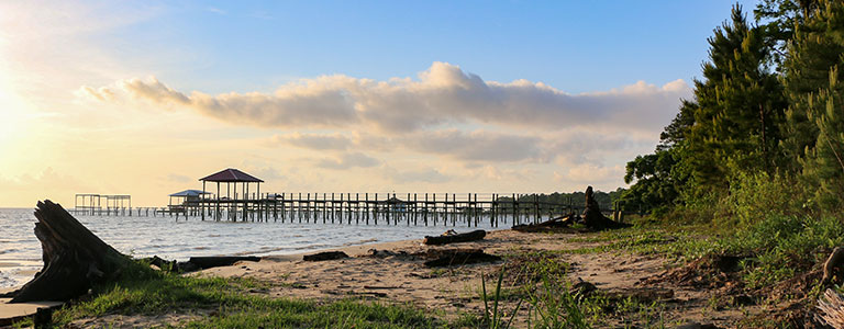 A coastal dock on an Alabama beach.