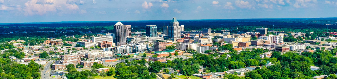 The downtown Greensboro skyline on a sunny day.